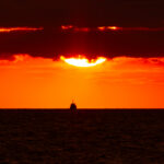 Fiery sunset over the Baltic Sea with a ship silhouette on the horizon, photographed from Paljassaare Peninsula, Estonia | Tulerõõmus päikeseloojang Läänemere kohal laeva siluetiga, pildistatud Paljassaare poolsaarelt, Eestist.