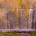 Jägala Waterfall in Estonia, captured in full flow during the spring, with surrounding nature and rocks / Jägala juga Eestis, jäädvustatud täisvoos kevadel, ümbritseva looduse ja kividega