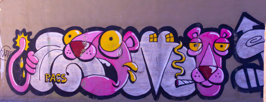Graffiti artwork of the Pink Panther character in bright colors / Roosa pantri graffitimaal erksates värvides