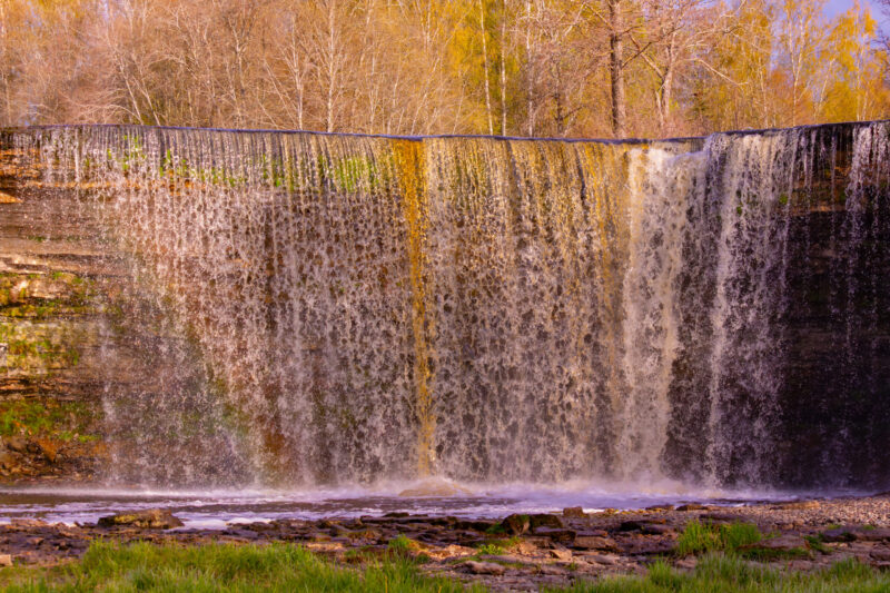 Jägala Waterfall in Estonia, captured in full flow during the spring, with surrounding nature and rocks / Jägala juga Eestis, jäädvustatud täisvoos kevadel, ümbritseva looduse ja kividega